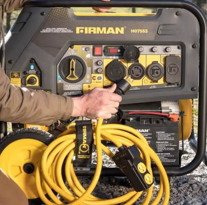 Man holding an extension cord trying to start his Firman generator