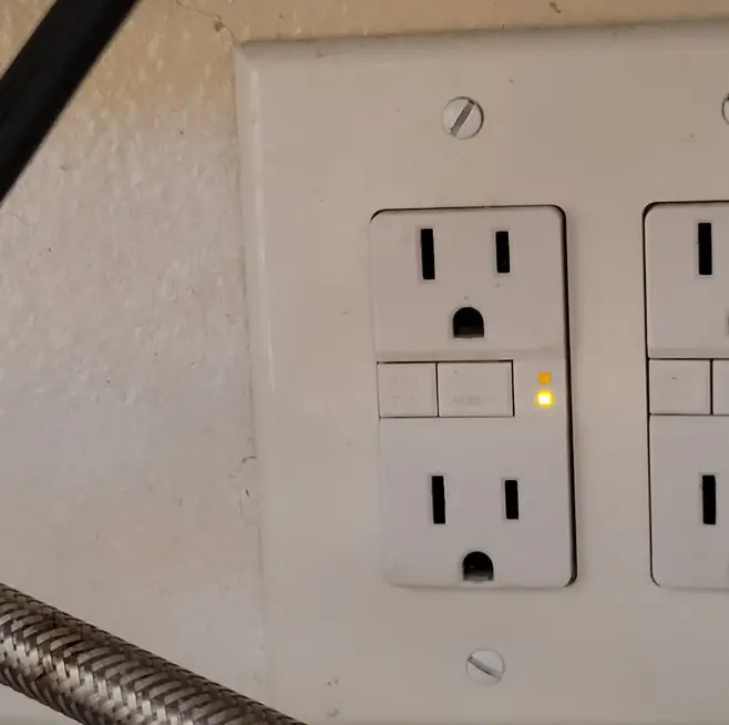 gfci outlet yellow light won't reset